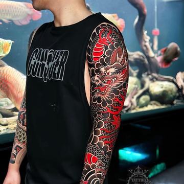 Red dragon Japanese sleeve tattoo with dark background