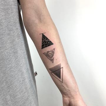 Three triangle tattoo design on the forearm