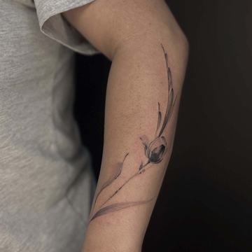 Delicate tulip flower tattoo with thin stems
