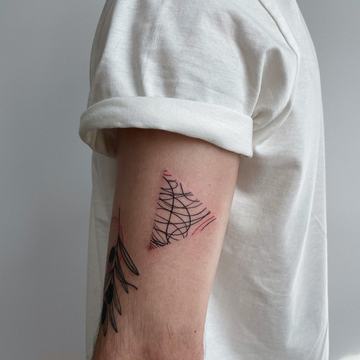 Minimal triangle tattoo with abstract linework