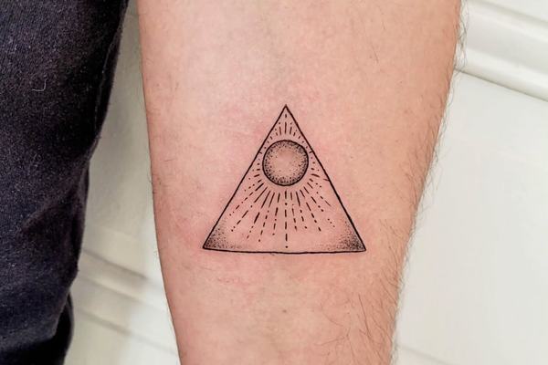 Fine line triangle tattoo with sun detail