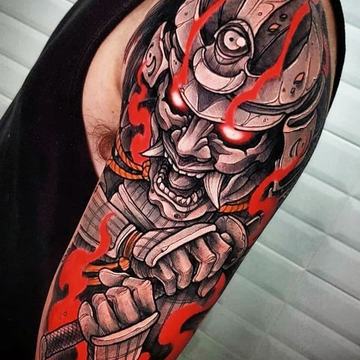 Samurai mask arm tattoo with red and black contrast